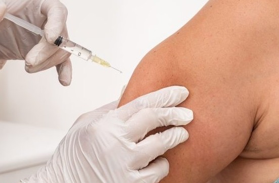 A medical professional preparing lipo injections for treating unwanted upper arm fat