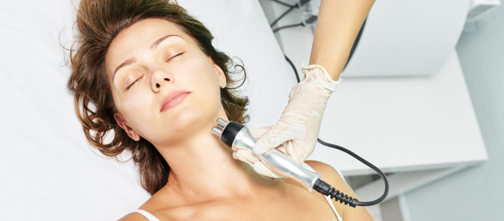 Radio Frequency treatment being applied to reduce a double chin and tighten the jawline